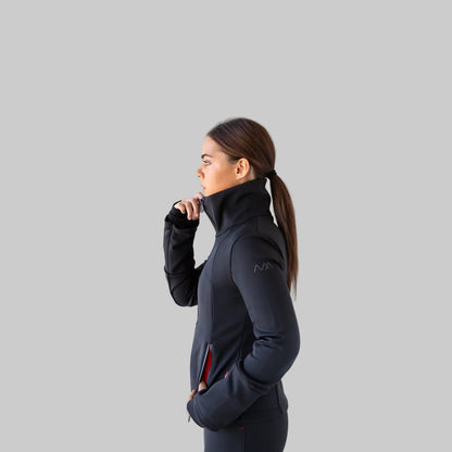 Woman wearing a black performance ski jacket with a visible brand logo on a white background